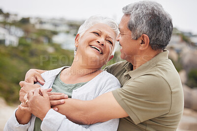 Buy stock photo Senior, couple and hug on beach for travel, vacation or holiday with happiness or relax in nature outdoor. Elderly, man or woman in retirement at ocean or sea for peace, freedom or adventure or smile