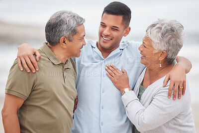 Buy stock photo Man, senior parents or laughing at beach for bond, support or love with smile, care or pride in retirement. Hug, father or mature mother with a happy son at sea together on family holiday vacation