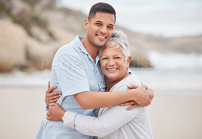 Man, senior mom or portrait at beach on mothers day for bond, support or love with smile, care or pride. Hug, retirement or mature mother with a happy son at sea together on family holiday vacation