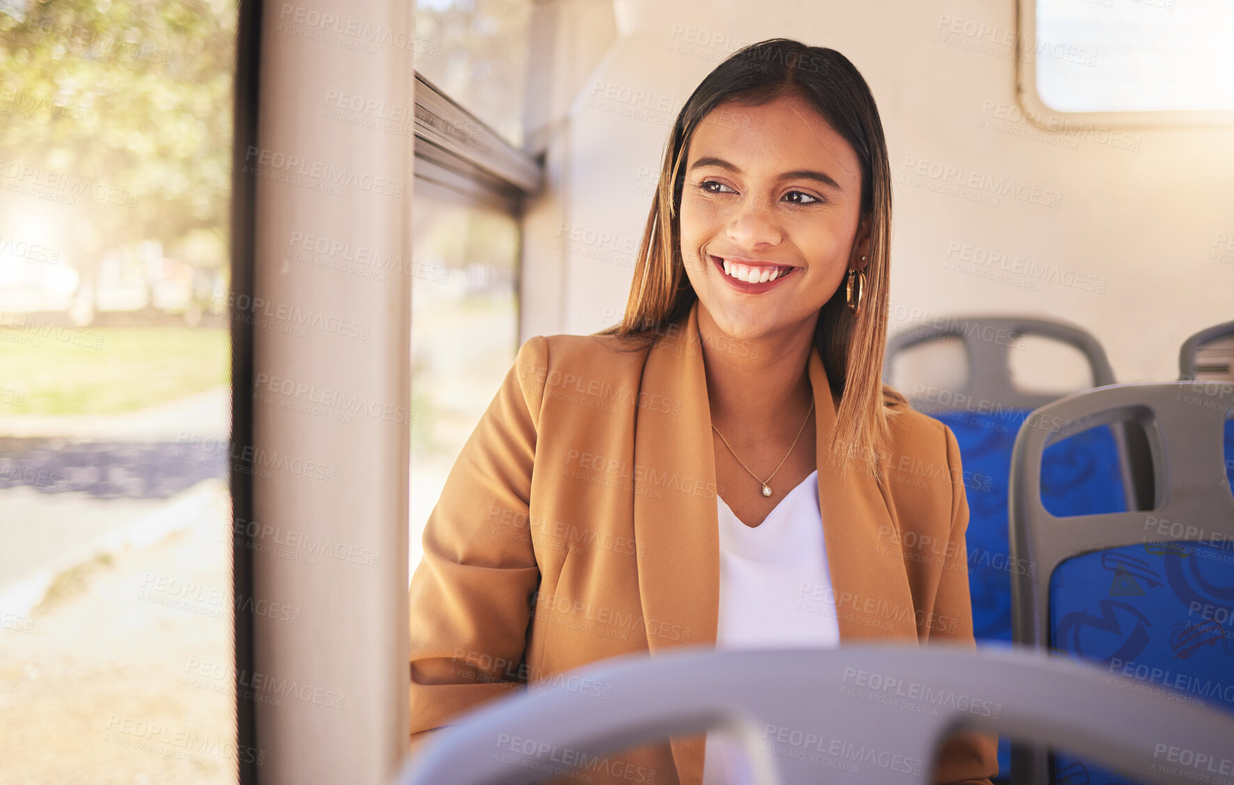 Buy stock photo Young, woman and commute to work by bus, public transportation and city with traffic. Employee, alone and smile in happiness on face for career, occupation and traveling with service, metro or auto