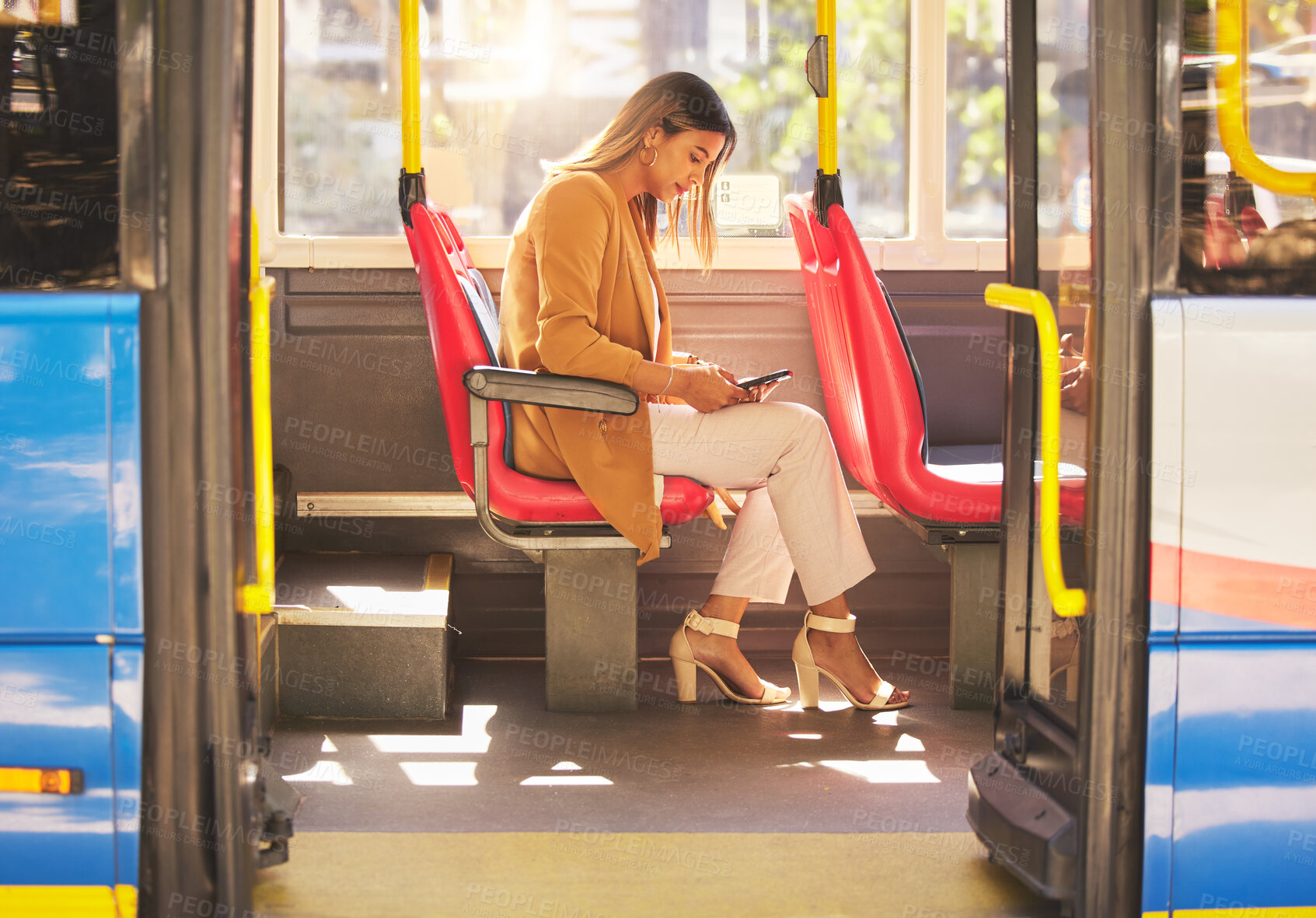 Buy stock photo Woman in bus, sitting and typing on smartphone for social media, email and and travel on urban commute. Public transport, service and drive, girl with phone reading schedule or agenda on road to work