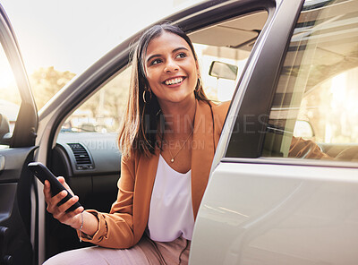 Buy stock photo Thinking, smile and a woman in a car with a phone for communication, social media or the internet. Happy, idea and a young girl in transport or a taxi with a mobile for travel information or update