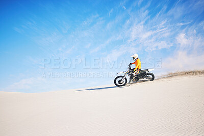 Buy stock photo Motorbike, travel and person with competition, sand and blue sky with sports, training and transport. Biker, desert and athlete with practice, fitness and safety with exercise, freedom and adventure