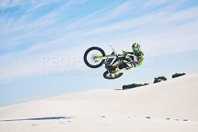 Buy stock photo Desert, motorbike and man jump for sport stunt outdoor, adventure and travel. Off road, air and driver on motorcycle on sand in nature for action, competition energy and freedom for extreme challenge