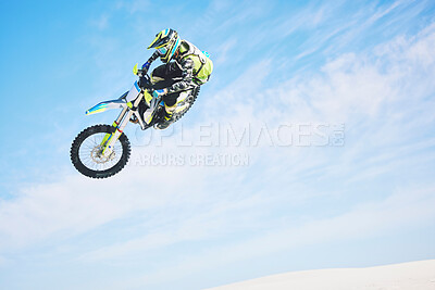 Buy stock photo Motorbike, jump and person in the air with blue sky, mock up and stunt in sports with fearless person in danger with freedom. Motorcycle, jumping and athlete training for challenge or competition