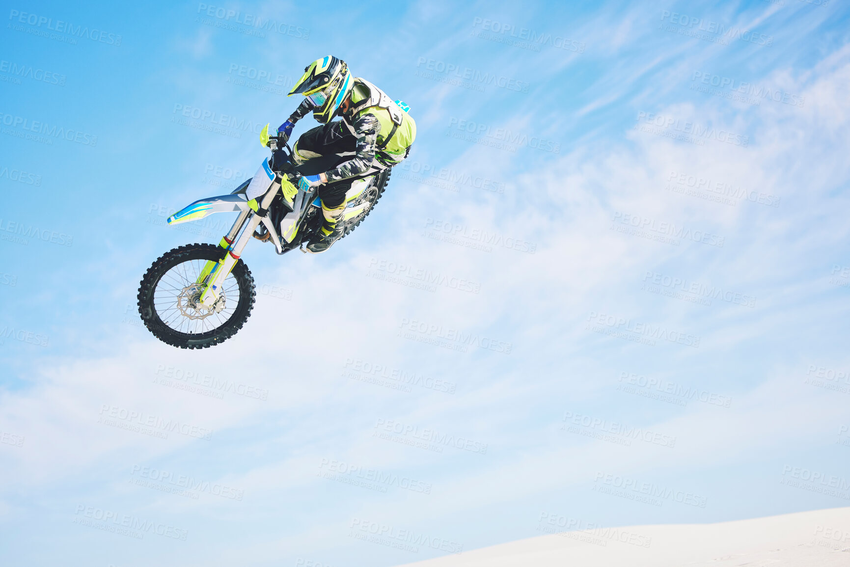 Buy stock photo Motorbike, jump and person in the air with blue sky, mock up and stunt in sports with fearless person in danger with freedom. Motorcycle, jumping and athlete training for challenge or competition