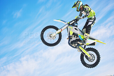 Buy stock photo Training, person and motorbike with sky background, fitness and exercise with competition. Biker, practice and athlete with a bike, sports and health with cycling, travel and freedom with energy