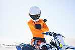Moto, person and desert for sports in portrait with break on holiday, vacation or trip in Namibia. Driver, rider and bike for activity, fearless or fast for fun in summer with friends, people or race