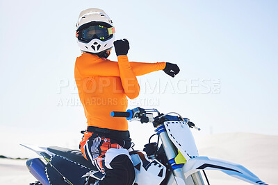 Buy stock photo Motorbike, arm stretch and ready for race in desert, training and practice for challenge on sand dunes. Athlete, fast and adrenaline in extreme sports, fitness and energy for competition on dirt bike