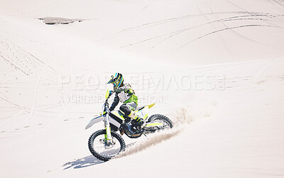 Buy stock photo Man, driving and motorbike on sand for sport, adventure or competition outdoor in summer and mockup space. Motorcycle, ride and athlete on dirt, dune or desert for race, danger and fearless challenge