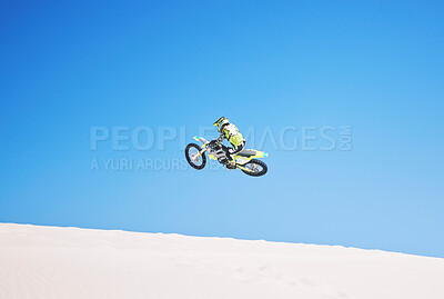 Buy stock photo Motorbike, jump and man in the air with blue sky, mock up and stunt in sports with fearless person in danger with freedom. Motorcycle, jumping and athlete training for challenge or competition