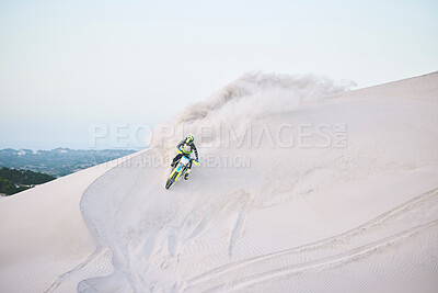 Buy stock photo Motorcycle, desert and race for sports in sand, adrenaline and training for fitness in competition. Athlete, sky and mockup for extreme sport, driving and dirtbike in outdoor for stunt or performance
