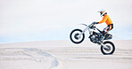Motorbike, person and sports with fitness, training and challenge with safety, desert and energy. Athlete, sand and biker with mockup, practice and cycling with exercise, travelling and adventure