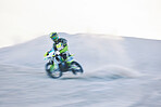 Blur, fast motorbike and man in desert for sports, action adventure or extreme travel on dirt on mockup space. Off road, sand and driver on motorcycle for speed in nature, competition race or freedom