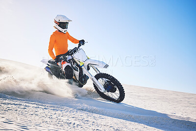 Buy stock photo Sport, motorbike and athlete with desert with sand on wheels, pride and skill for adrenaline. Biker, sunshine and dust with blue sky in fun, fitness and achievement in speed, race or dubai vacation 