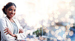 Black woman, arms crossed and city portrait with a smile from business consultant work with mockup space. Confidence, female entrepreneur and professional from New York happy on urban road with bokeh