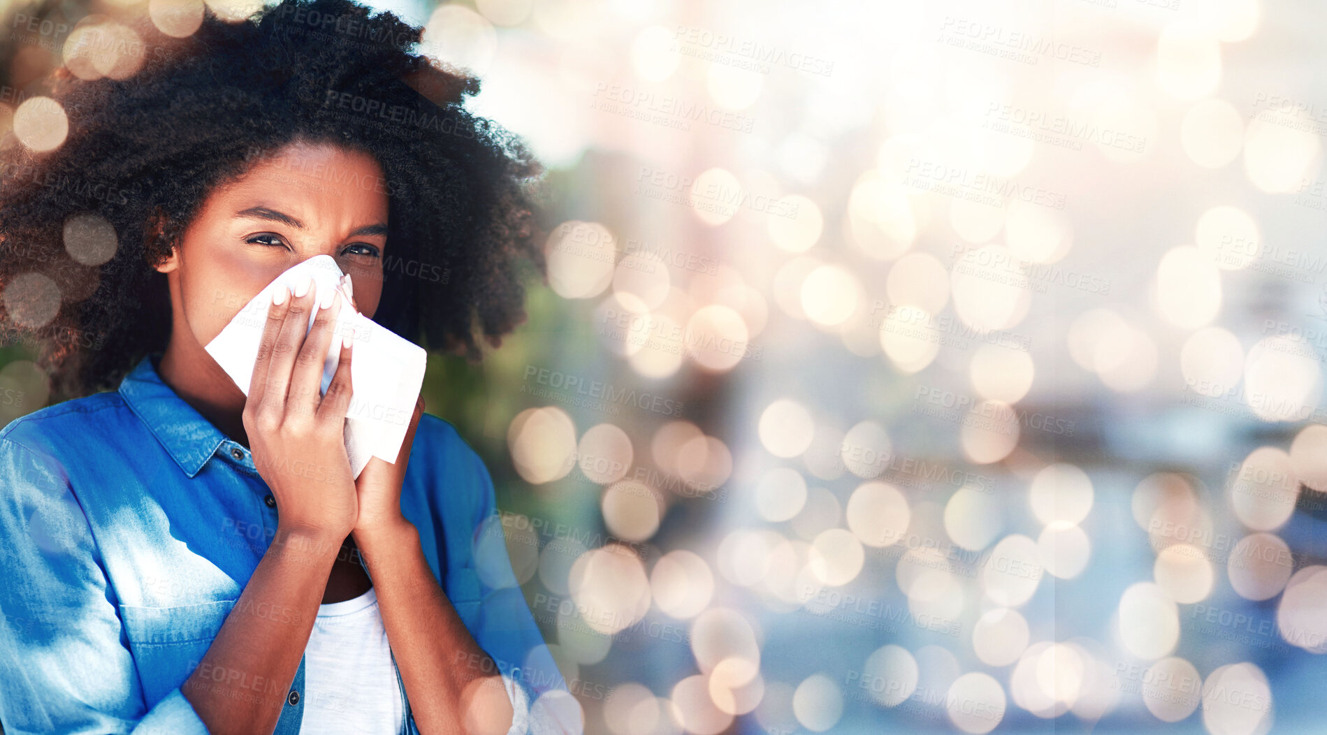 Buy stock photo Black woman, blowing nose and allergies, sick with health fail on banner and bokeh, portrait and sinus infection. Healthcare, wellness and illness with mockup space, toilet paper for cold or flu