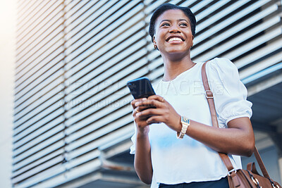 Buy stock photo Phone, smile and young woman in the city networking on social media, mobile app or the internet. Happy, technology and African female person scroll on cellphone and walking in urban town street.