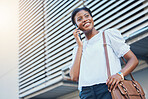 Phone call, walking and young woman in city with communication, discussion or networking. Happy, technology and African female person on mobile conversation with cellphone commuting in town street.