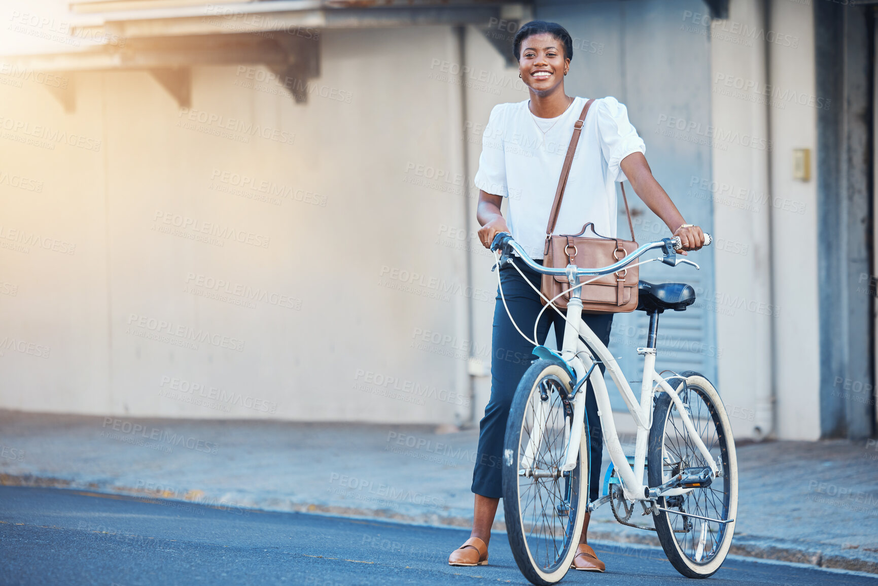 Buy stock photo Black woman, bicycle commute and urban road in city with sustainability travel, ride and morning with smile. Happy worker, female professional and employee with bike outdoor with mockup space