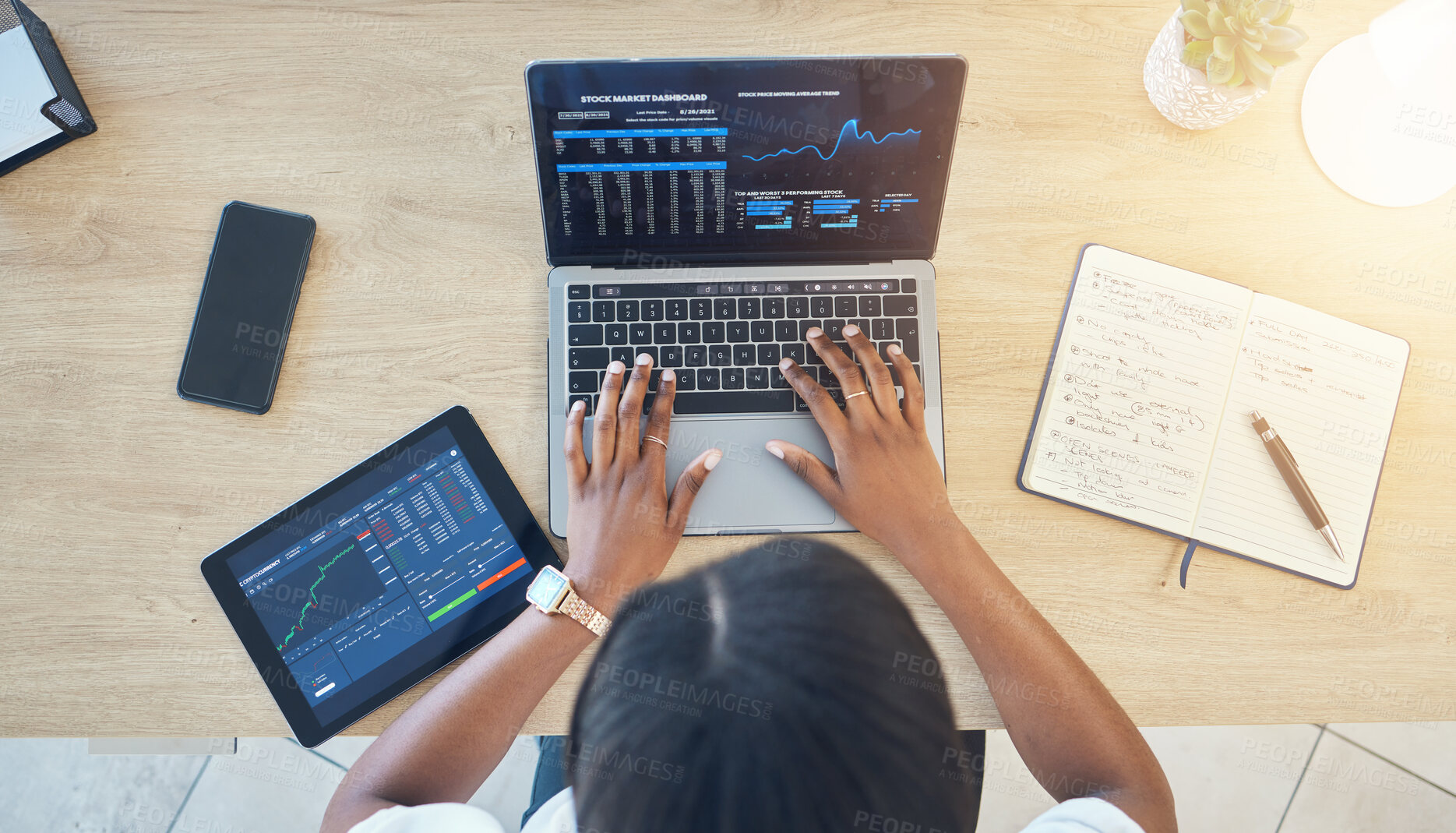 Buy stock photo Person, hands and laptop, stock market and trading with tablet, notebook and typing top view of workspace. Cryptocurrency, research and investment with dashboard, stats and graph on screen for trader