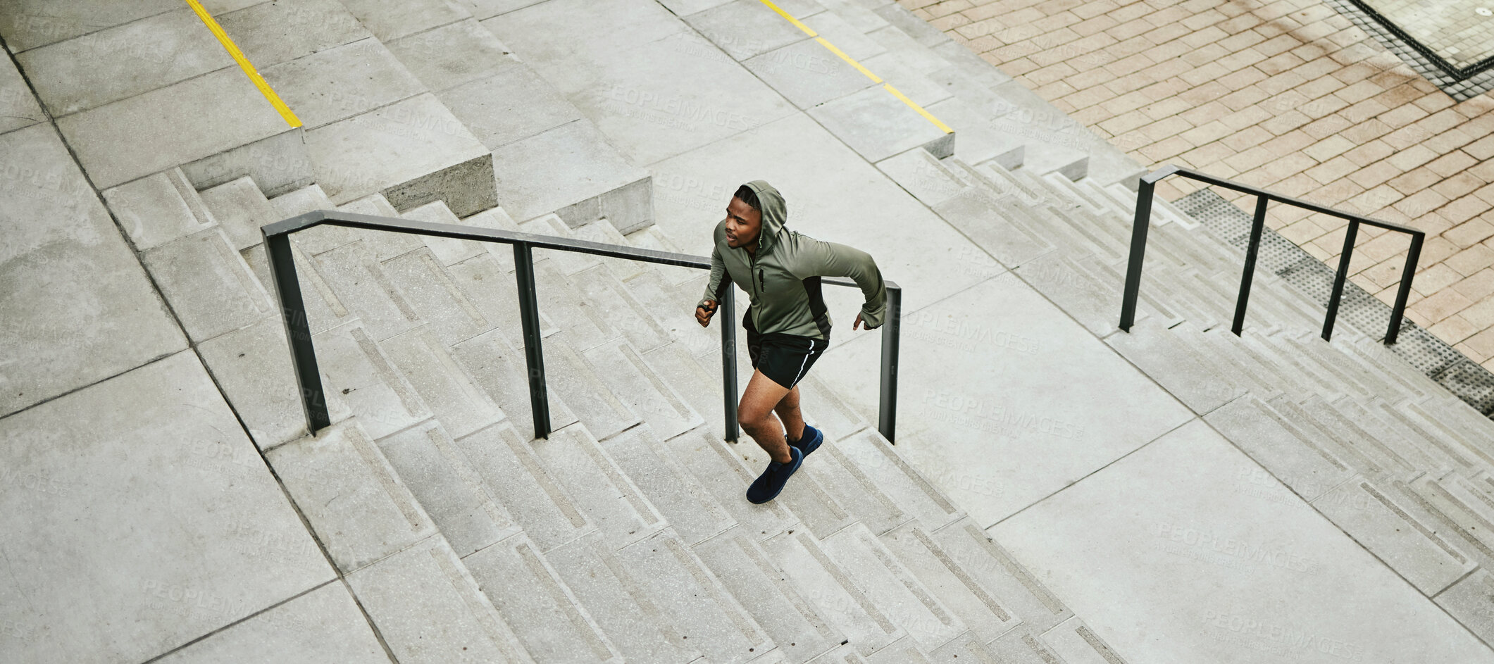 Buy stock photo Fitness, city and black man running on stairs outdoor, exercise and training healthy body in urban town top view. Sports, cardio and African athlete on steps for workout, energy and jog for wellness