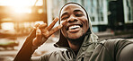 Happy black man, face and peace sign in city for selfie, fitness or photography after running or exercise. Portrait of African male person smile with emoji for photograph, picture or memory in town