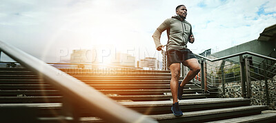 Buy stock photo Fitness, city and black man running on steps outdoor, exercise and training healthy body in the morning at sunrise. Sports, cardio and African athlete on stairs for workout, wellness and lens flare