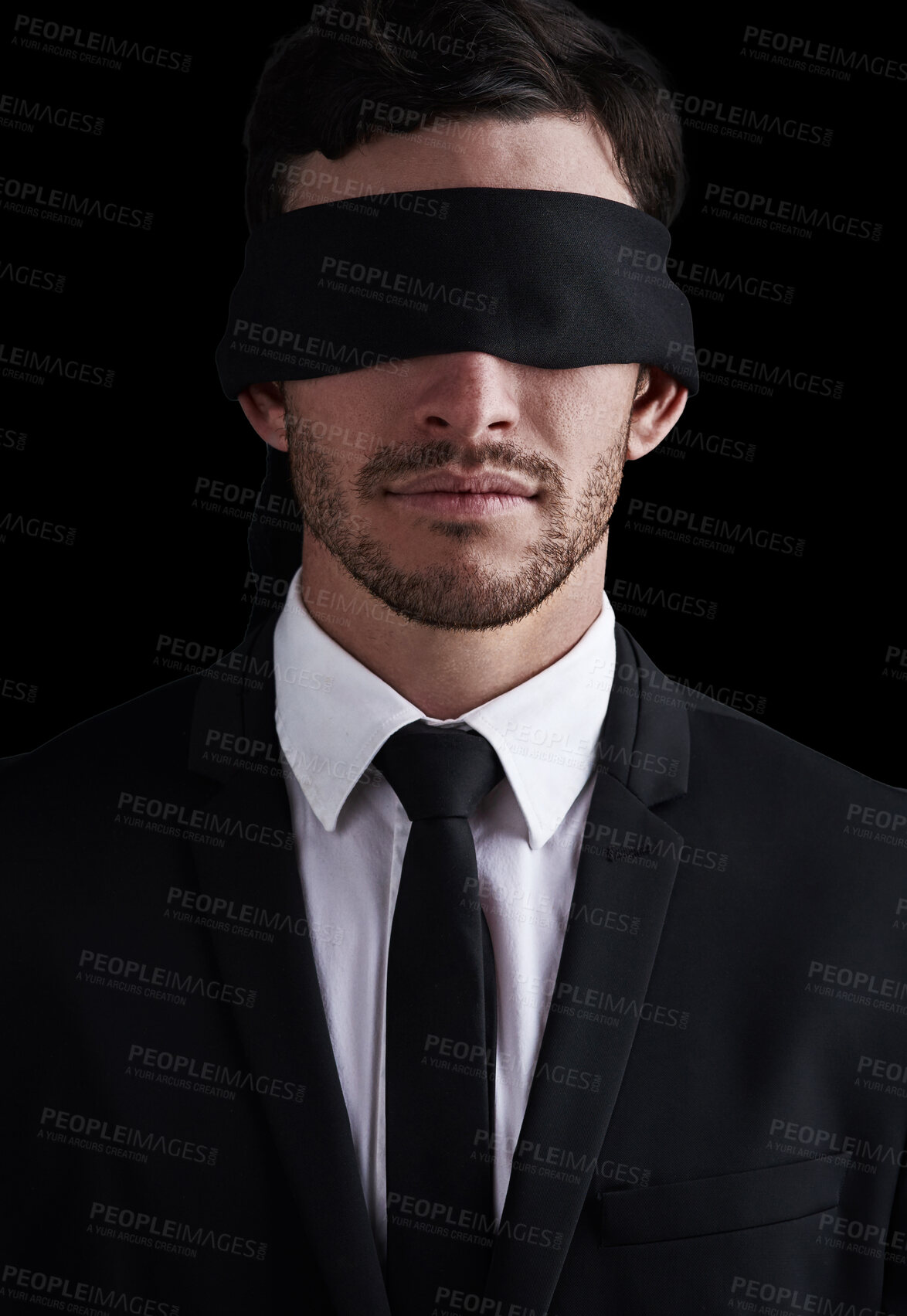 Buy stock photo Dark, vision and a business man in a blindfold on a black background for control or censorship. Oppression, lost and blinded with a young corporate employee unaware of future issues as a professional