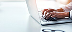 Hands, laptop and a business woman typing on space in the office while working on a report or research. Computer, mockup and flare with a professional employee closeup at a desk in the workplace