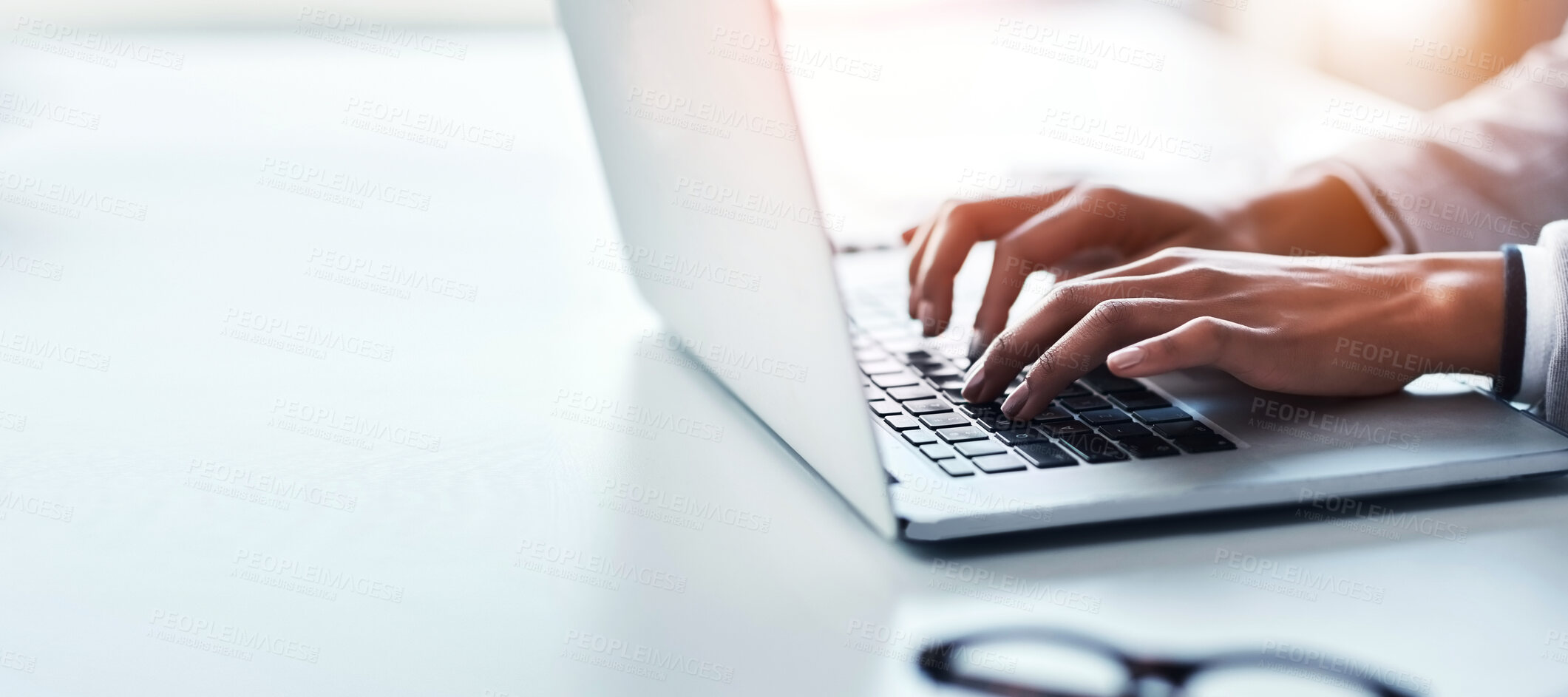 Buy stock photo Hands, laptop and a business woman typing on space in the office while working on a report or research. Computer, mockup and flare with a professional employee closeup at a desk in the workplace