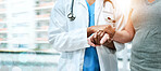 Closeup, doctor and patient with support, holding hands and teamwork with lens flare, banner and healthcare. People, medical professional and woman with medicare, hospital and compassion with empathy