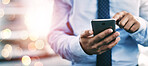 Businessman, phone and hands typing for communication or networking on bokeh background at office. Closeup of man on mobile smartphone app for online texting, chatting or social media and research