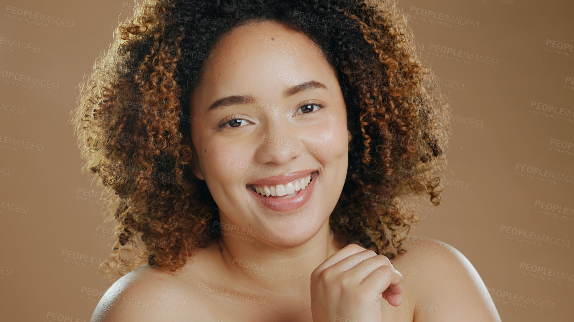 Buy stock photo Face of happy woman, natural beauty dermatology and cosmetic wellness in studio with smile. Skin glow, portrait or confident biracial female model with skincare results or pride on brown background