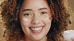 Black woman, skincare and cream on face for dermatology, beauty or happiness on brown background in studio. Skin, care or happy portrait with cosmetics, lotion or sunscreen for  facial wellness