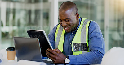 Buy stock photo Tablet, laptop and a black man construction worker in an office for planning a building project. Technology, smile and a happy young engineer in the workplace for research as a maintenance contractor