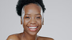 Face, skincare and beauty of excited black woman in studio isolated on a gray background mockup space. Portrait, natural cosmetics and African model in spa facial treatment, wellness and skin health
