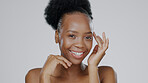 Face, skincare and hands of happy black woman in studio isolated on a gray background. Portrait, touch and natural beauty cosmetics of model in spa facial treatment for wellness, health or aesthetic