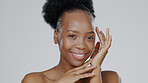 Face touch, skincare and happy black woman in studio isolated on a gray background mockup space. Portrait, hands and natural beauty cosmetics of model in spa facial treatment, wellness and health