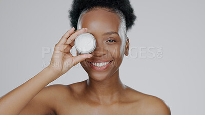 Buy stock photo Face, model and hands with eye cream for cosmetic, hand gesture and beautiful skin in studio background. Black woman, moisturizer and serum for dermatology with self care portrait and smile in mockup