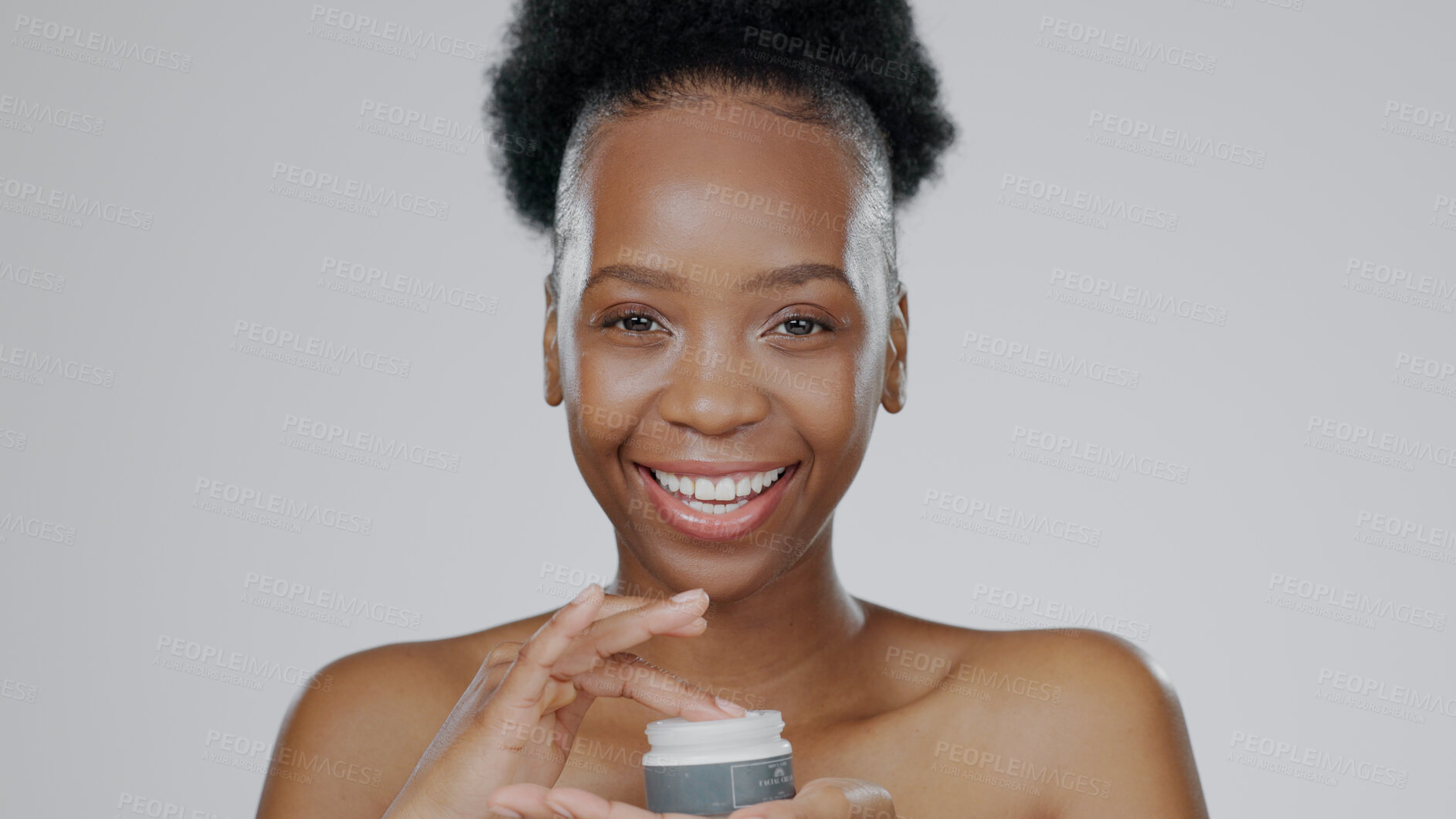 Buy stock photo Face, model and hands in beauty cream for cosmetic, glow and happiness with skincare in studio background. Black woman, healthy skin and dermatology for cosmetics in moisturizer, smile and mockup