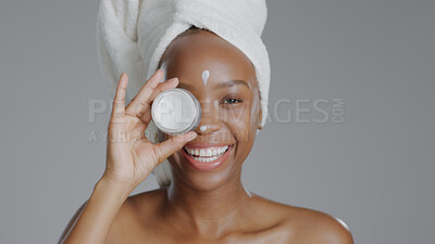 Buy stock photo Woman, moisturizer and smile in portrait for skincare or beauty, health and wellness or dermatology. Happy black person, skin and cosmetics with glow, care and lotion in studio by gray background