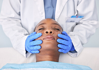 Buy stock photo Massage, hands and a skin analysis on a black woman from a doctor for healthcare or dermatology. Spa, wellness and an African patiennt with a facial rub from a medical employee for a cleaning