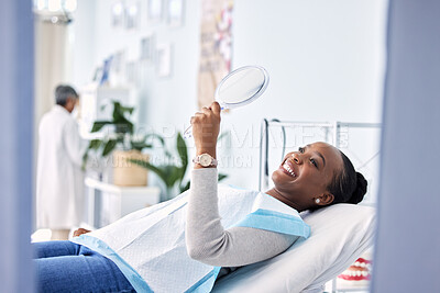 Buy stock photo Smile, mirror and black woman at dentist on chair in clinic, tooth treatment and cleaning. Reflection, dental orthodontics and happy person teeth whitening, oral hygiene and healthcare for wellness