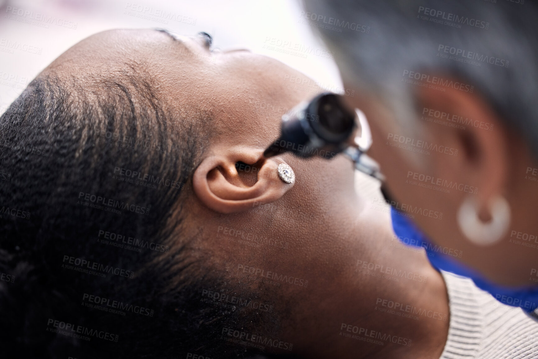 Buy stock photo Healthcare, doctor or woman for hearing consultation from infection or ear problem with otoscope at clinic. Otolaryngology, professional and black person for medical exam, test or patient for checkup