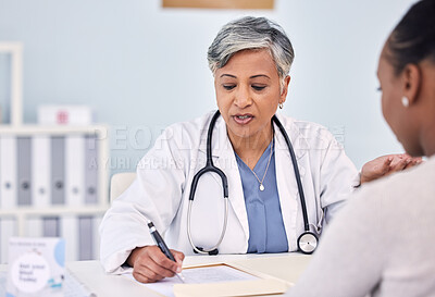 Buy stock photo Senior doctor, patient and writing consultation for prescription, diagnosis or checkup at hospital. Mature female person, medical or healthcare surgeon filling paperwork or life insurance at clinic