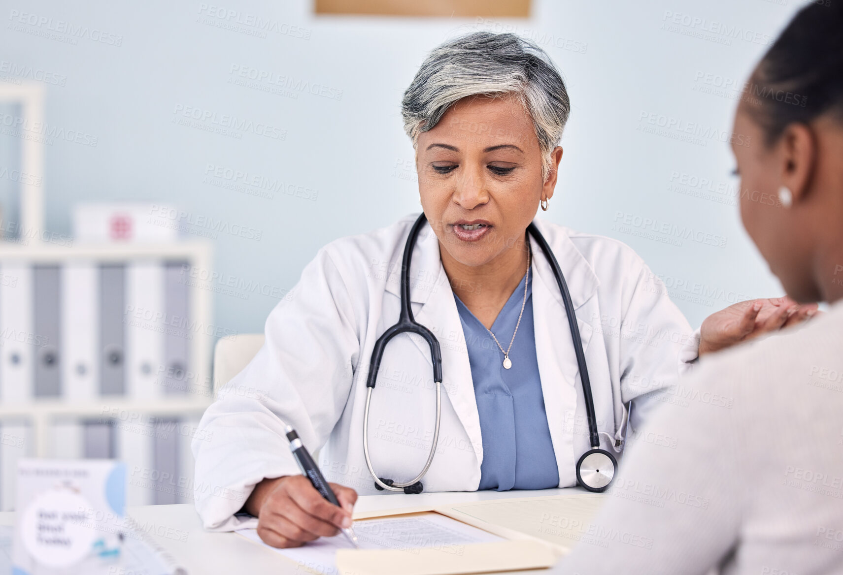 Buy stock photo Senior doctor, patient and writing consultation for prescription, diagnosis or checkup at hospital. Mature female person, medical or healthcare surgeon filling paperwork or life insurance at clinic