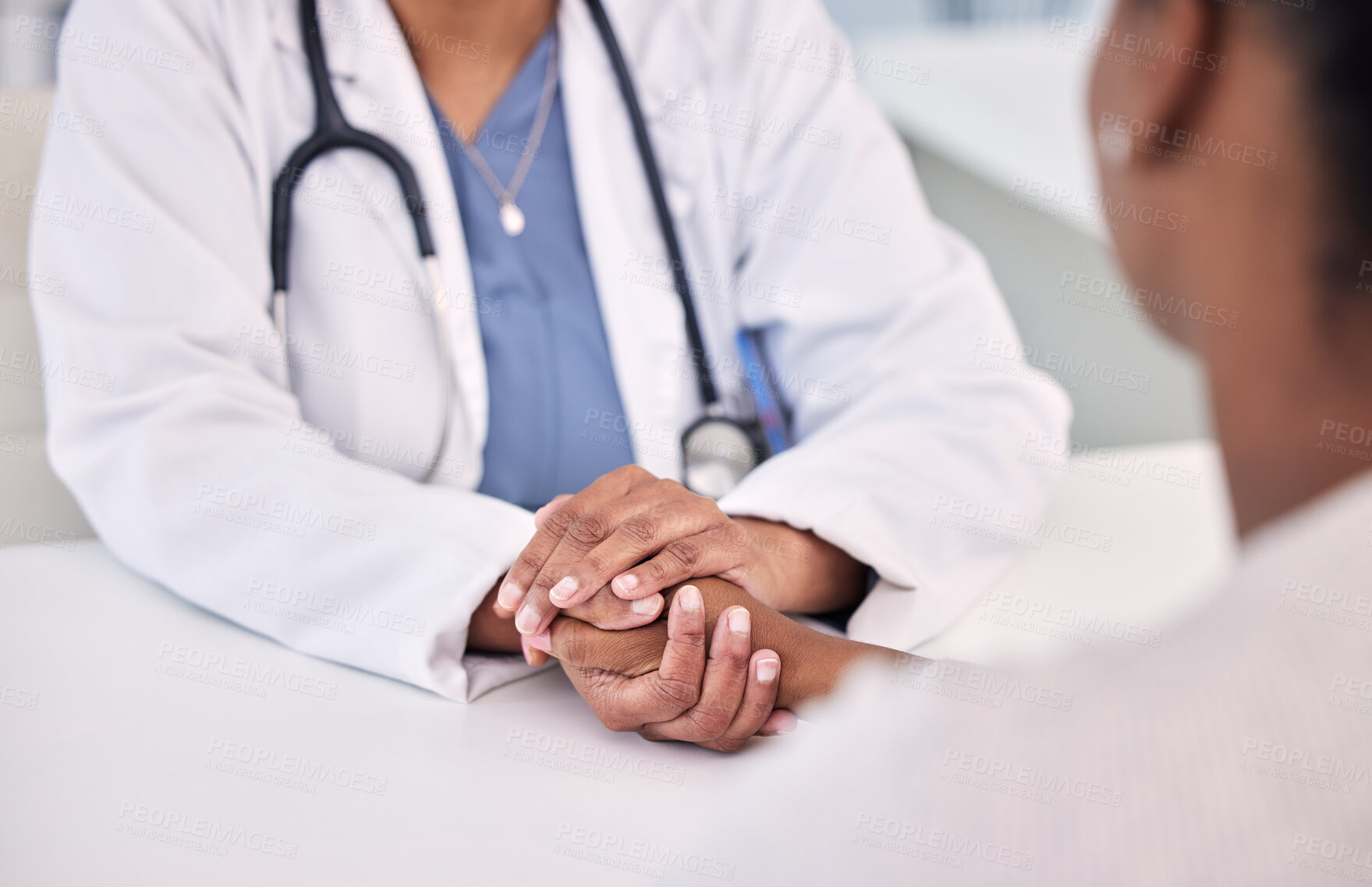 Buy stock photo Healthcare, holding hands and doctor with woman in clinic for support. empathy or care. Checkup, discussion and closeup of female medical worker with sympathy for African patient in medicare hospital