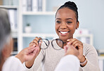 Eye care, glasses and black woman with optometrist at clinic, vision and healthcare with wellness and choice. Prescription lens, frame with help or advice, designer eyewear or spectacles with smile