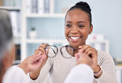 Buy stock photo Eye care, glasses and black woman with optometrist at clinic, vision and healthcare with wellness and choice. Prescription lens, frame with help or advice, designer eyewear or spectacles with smile